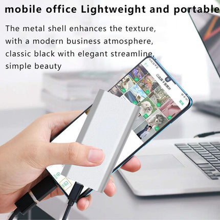 Hand holding a smartphone with a stylus, displayed on a blurred office background.