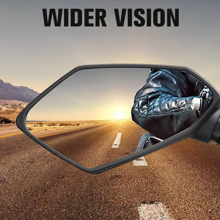 Motorcycle mirror reflecting a desert road with mountains and 'Wider Vision' text.