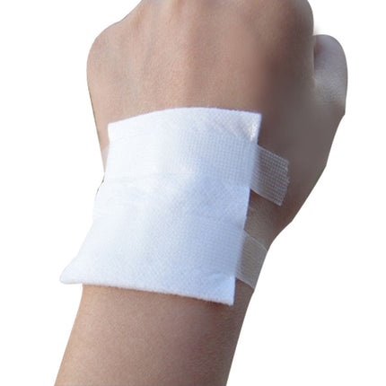 Hand with a white bandage on a white background