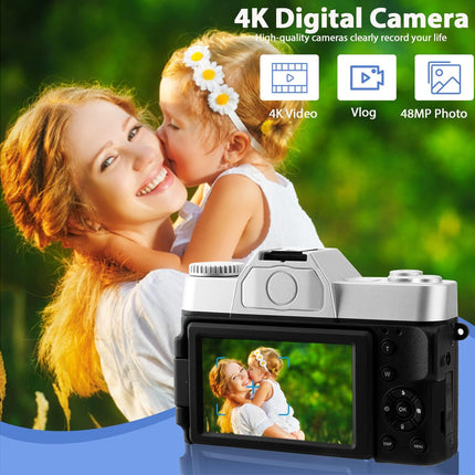 Digital camera with a screen displaying a photo of a woman and a child, set against a natural background.