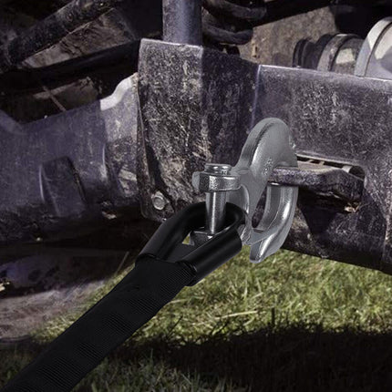 Close-up of a lawn mower blade attachment on a tractor.