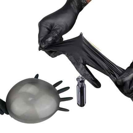 Black gloves interacting with a black balloon and a small black object on a white background