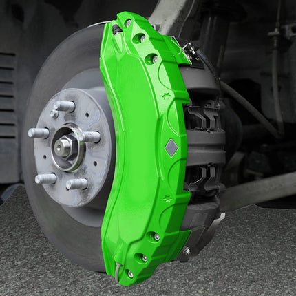 Close-up of a green brake caliper on a vehicle's wheel.