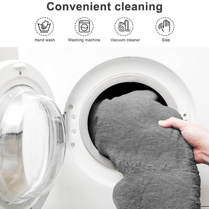 Gray towel being placed into a washing machine with icons and text indicating cleaning methods.
