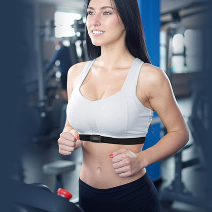 Woman exercising on a treadmill in a gym setting
