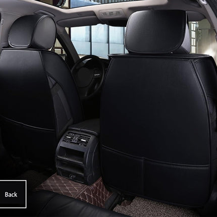 Car interior with black seat covers on the back seat