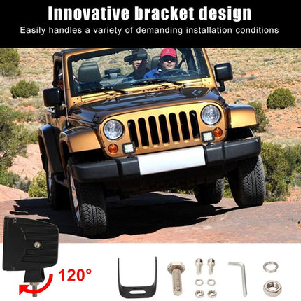 Gold Jeep Wrangler with a bracket design on a desert road, featuring tools and hardware.