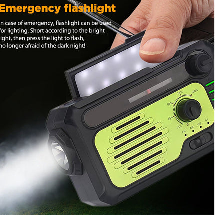 Hand holding a flashlight with radio emitting light on a dark background.