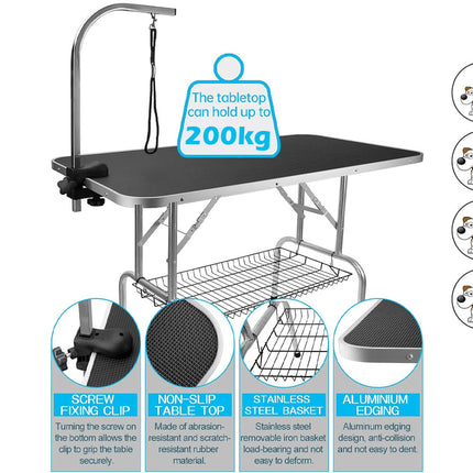 Dog grooming table with features highlighted on a white background