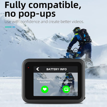 A black action camera with a screen showing battery information, placed in front of a snowy mountain scene with a snowmobile rider. Large text at the top reads 'Fully compatible, no pop-ups' and 'Use with confidence and create better videos.