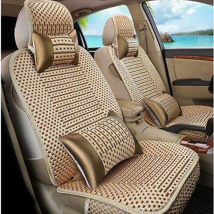 Beige and brown woven car seat covers with matching headrests and lumbar pillows installed on the front seats of a vehicle.