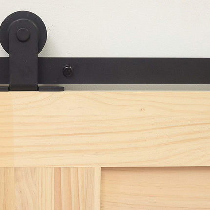 Wooden sliding door with black metal slide track and roller on a white background