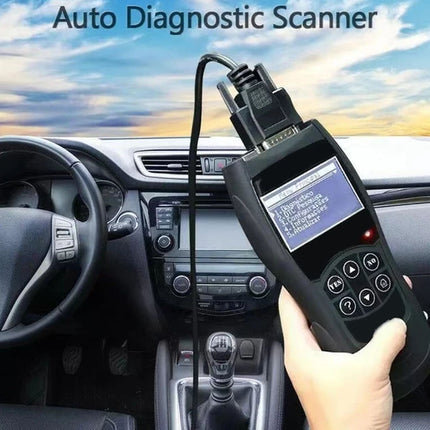 Auto diagnostic scanner held by a person with a car interior background