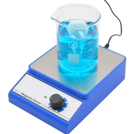A blue and silver magnetic stirrer with a clear glass beaker filled with bright blue liquid, shown on a white background.