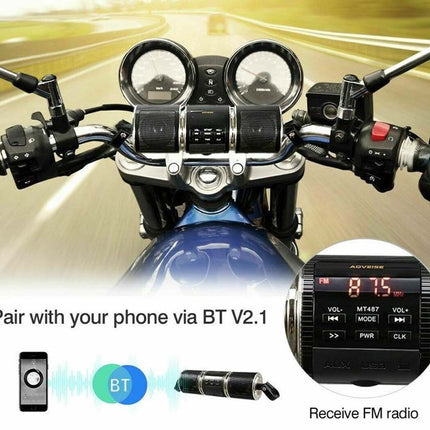 A motorcycle dashboard display screen showing FM radio and Bluetooth connection interface, with a close-up of the black digital display unit, text reading 'Pair with your phone via BT V2.1', and 'Receive FM radio' on a blurred road background.
