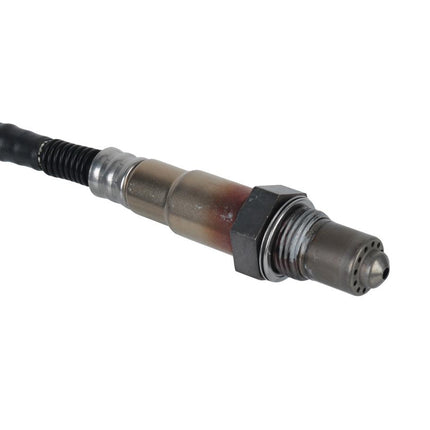 Mechanical component with a black cable on a white background