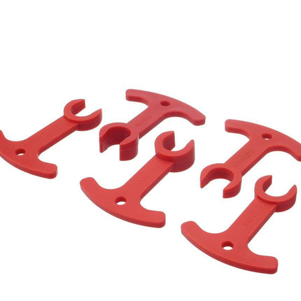 Five red plastic T-handle wrenches arranged in a fan shape on a plain white background.