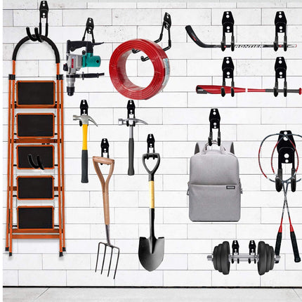 Wall-mounted tool organizer with various gardening tools on a tiled wall background