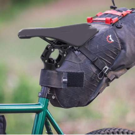 Bicycle saddle bag attached to a bike with a blurred green background