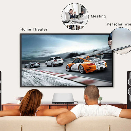 A large wall-mounted television displaying a race scene, shown in a living room setup with two people on a couch in front and two inset circles labeled Meeting and Personal work above. The TV is flanked by tall speakers.