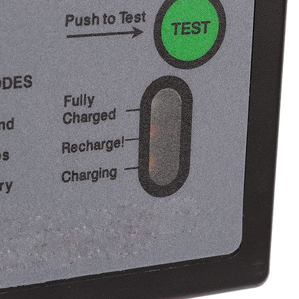 Close-up of a battery charger display with a green 'TEST' button and charging indicators.