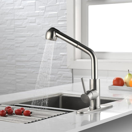 Modern kitchen faucet with water flowing into a sink, surrounded by fruits on a white countertop.