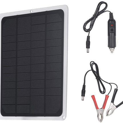 Solar panel with wiring and clamps on a white background