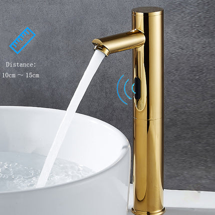 A modern single-handle bathroom faucet in polished gold finish, shown with running water into a white round sink. Blue graphic overlays indicate a touch sensor and a 10cm-15cm distance.