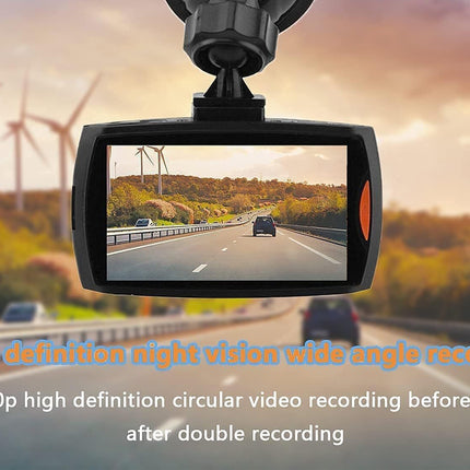 Car dashboard camera recording a road with wind turbines in the background