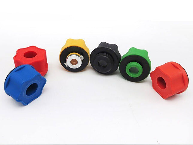 Set of colorful plastic knobs on a white background