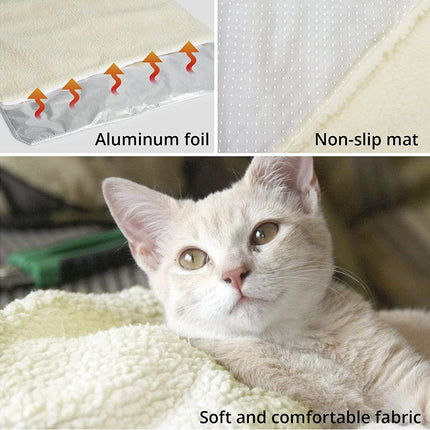 Cat lying on a soft fabric surface with aluminum foil and non-slip mat labeled above.