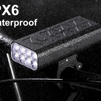 Waterproof bike light with IPX6 rating on a dark background