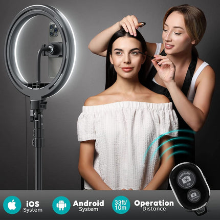 Woman using a selfie ring light with a remote control on a dark background