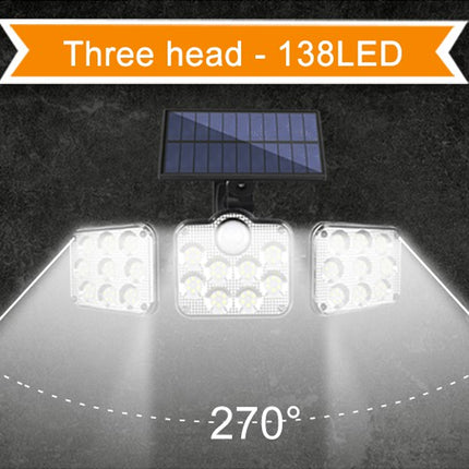 Solar-powered LED light system with three heads and 138 LEDs on a dark background.
