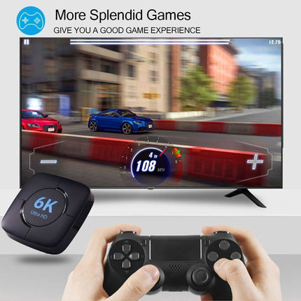 Gaming console with controller and TV displaying a racing game