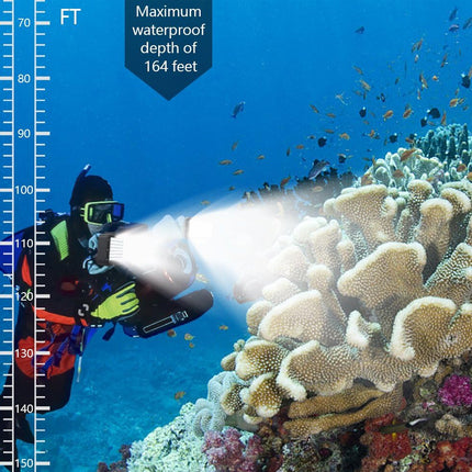 Underwater coral reef scene with a scuba diver holding a bright flashlight, plus a vertical depth scale on the left and text stating maximum waterproof depth of 164 feet.