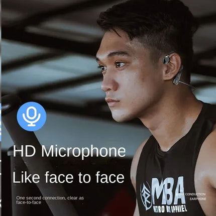 Person wearing a black tank top with 'MBA' text, using an HD microphone feature.