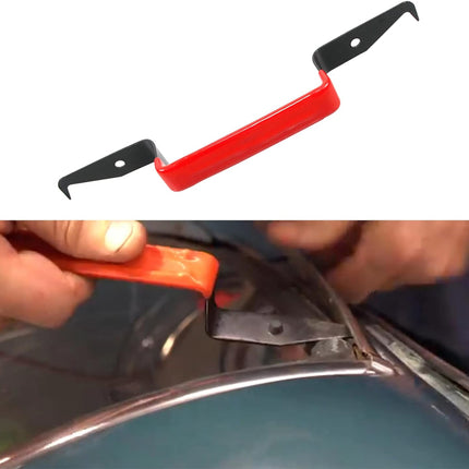 Red and black metal tool being used on a metallic surface