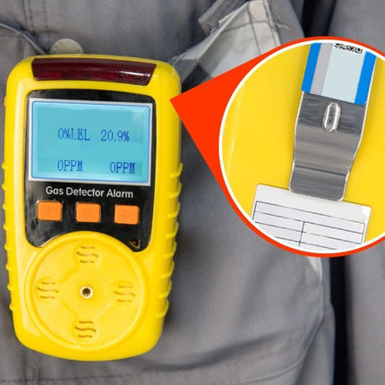 Yellow gas detector alarm on a gray jacket with an inset showing a label.