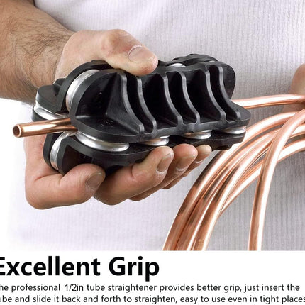 Hand holding a black tube straightener with copper tubes, against a white background.