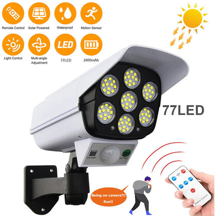 Outdoor security camera with LED lights and remote control on a white background