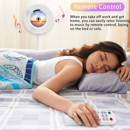 Woman lying on a bed with a remote control, relaxing to music.