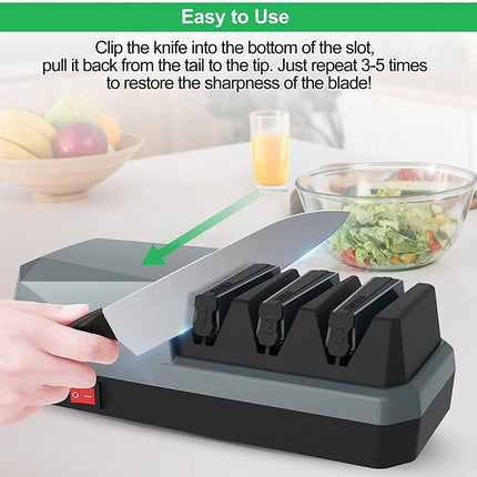 A hand is shown using a black and gray knife sharpener on a kitchen countertop, with a green arrow graphic and text explaining how to clip and pull the knife. A bowl of fruit, a glass of juice, and a salad are blurred in the background.