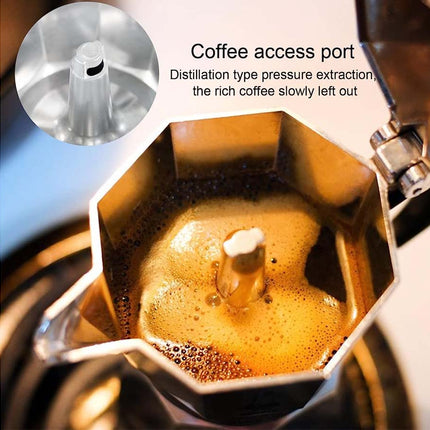 Coffee maker with coffee being extracted, showing a close-up of the coffee access port.