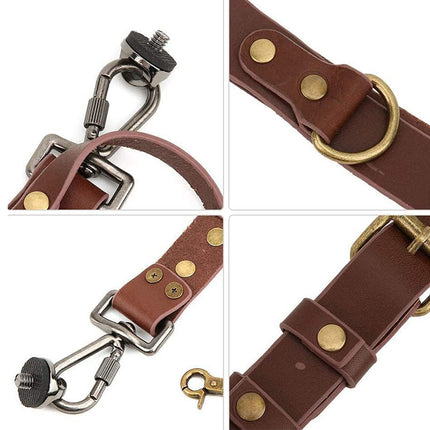 Brown leather strap with metal hardware on a white background