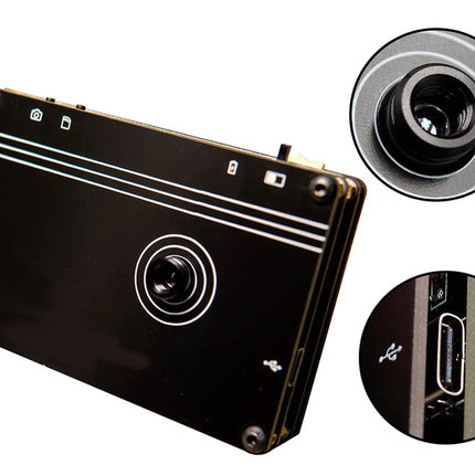 Black electronic device with camera lens and close-up details on a white background