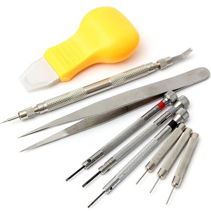 Set of precision tools including tweezers and screwdrivers on a white background