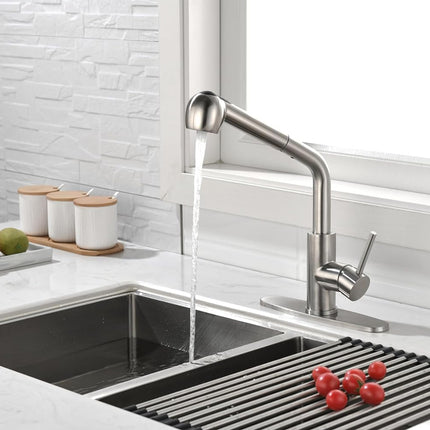 Modern kitchen sink with a faucet and fruits on a countertop