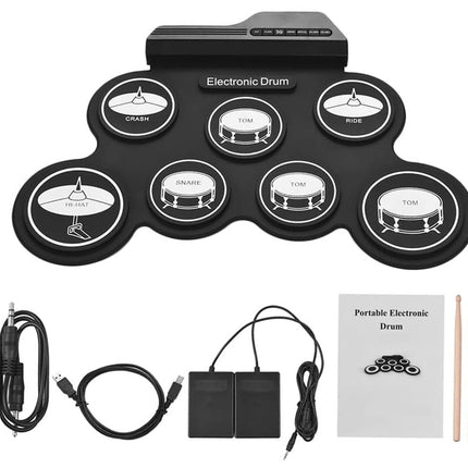 Portable electronic drum set with connectivity cables, power adapter, and drumsticks on a white background
