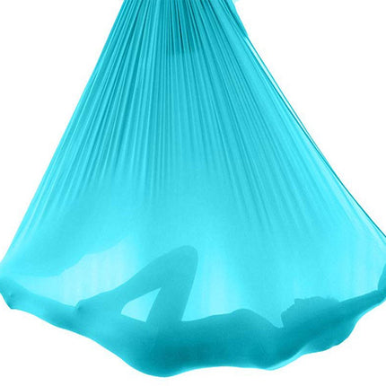 Turquoise aerial yoga hammock on a white background